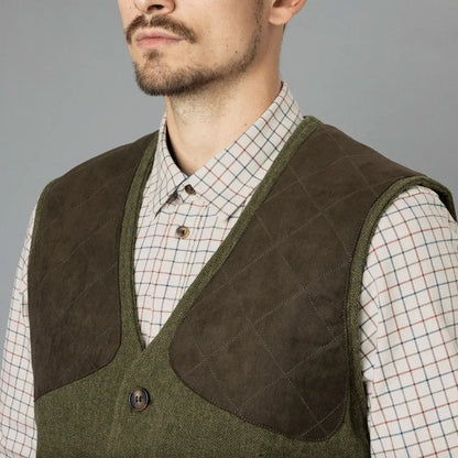 Hunting vest with shoulder patches over a checked shirt, showcasing the Seeland Hillside Waistcoat