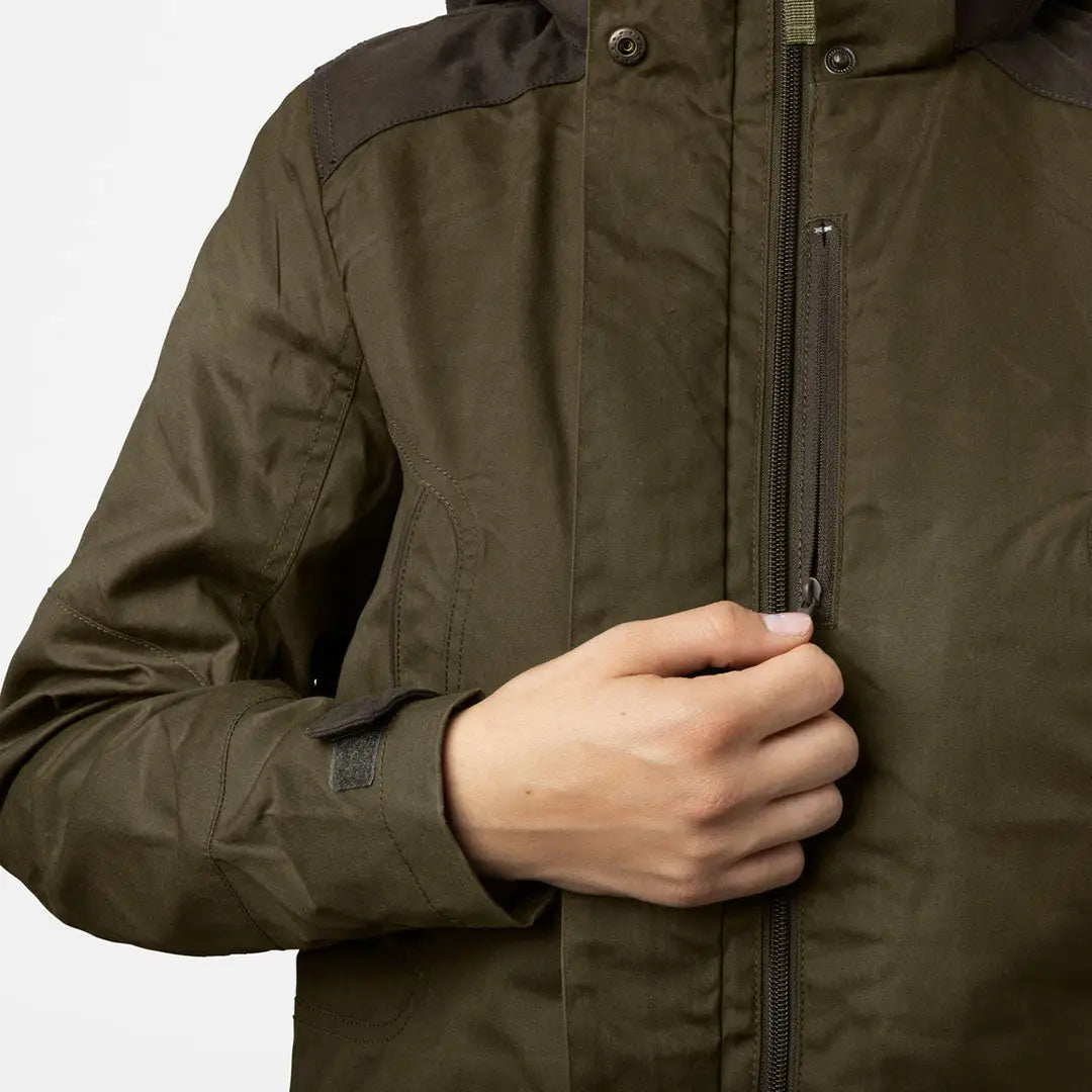 Olive green Seeland Key-Point Kora Jacket being held closed by a hand