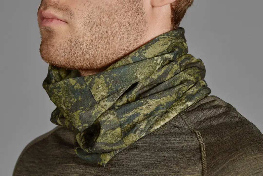 Camouflage neck gaiter styled over dark shirt collar from Seeland Neck Gaiter 2-Pack