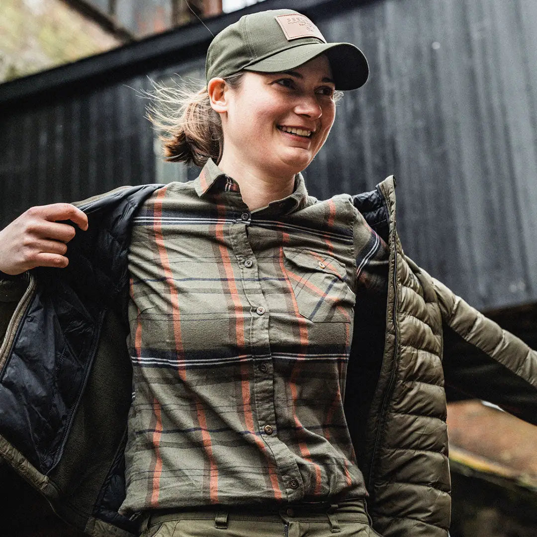 Smiling person in a Seeland Skye plaid shirt, perfect for country clothing and hunting