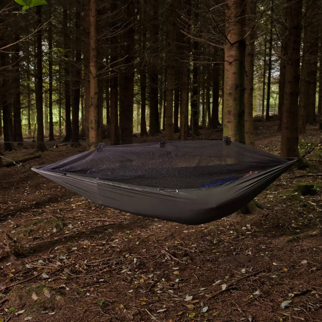 Relaxing in a Snugpak Jungle Hammock with a mosquito net built for an undisturbed night’s sleep