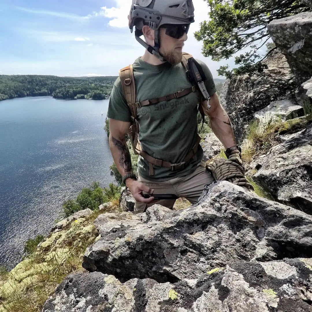 Rock climber in Snugpak T-Shirt, ready for outdoors adventure by the lake