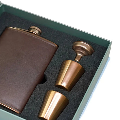 Leather-covered hip flask and shot glasses in a Sophos 4 Piece Copper Hip Flask Set