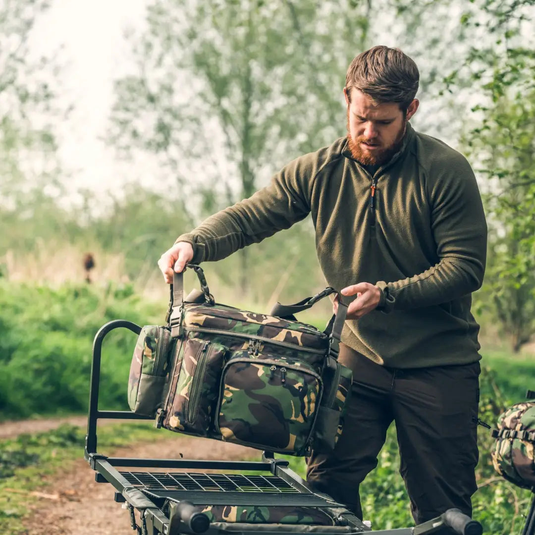 Camouflage-patterned Speero Modular Cool Bag on a wheeled cart for easy transport