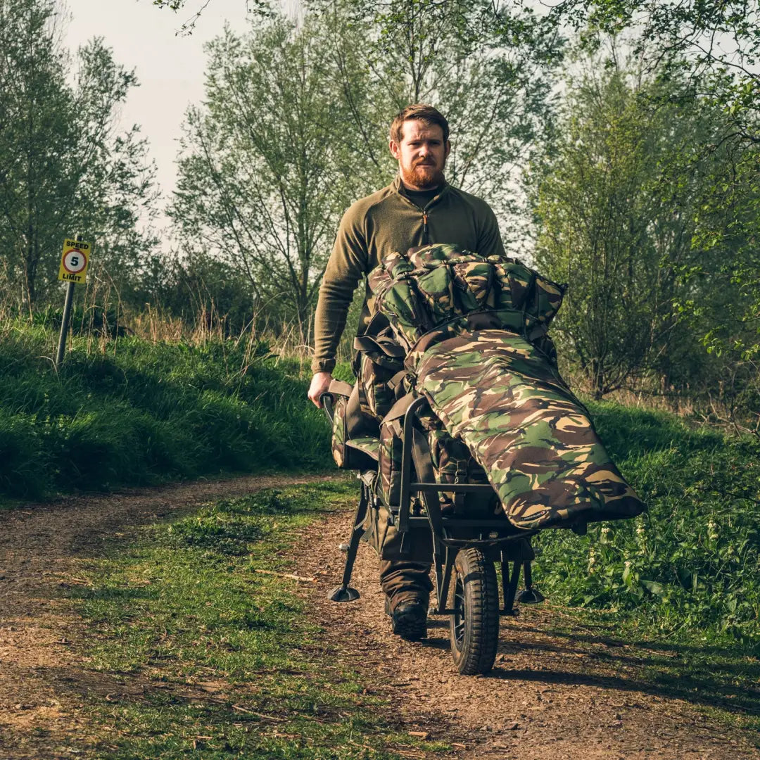 Military-style motorcycle with camouflage and gear for outdoor hunting adventures