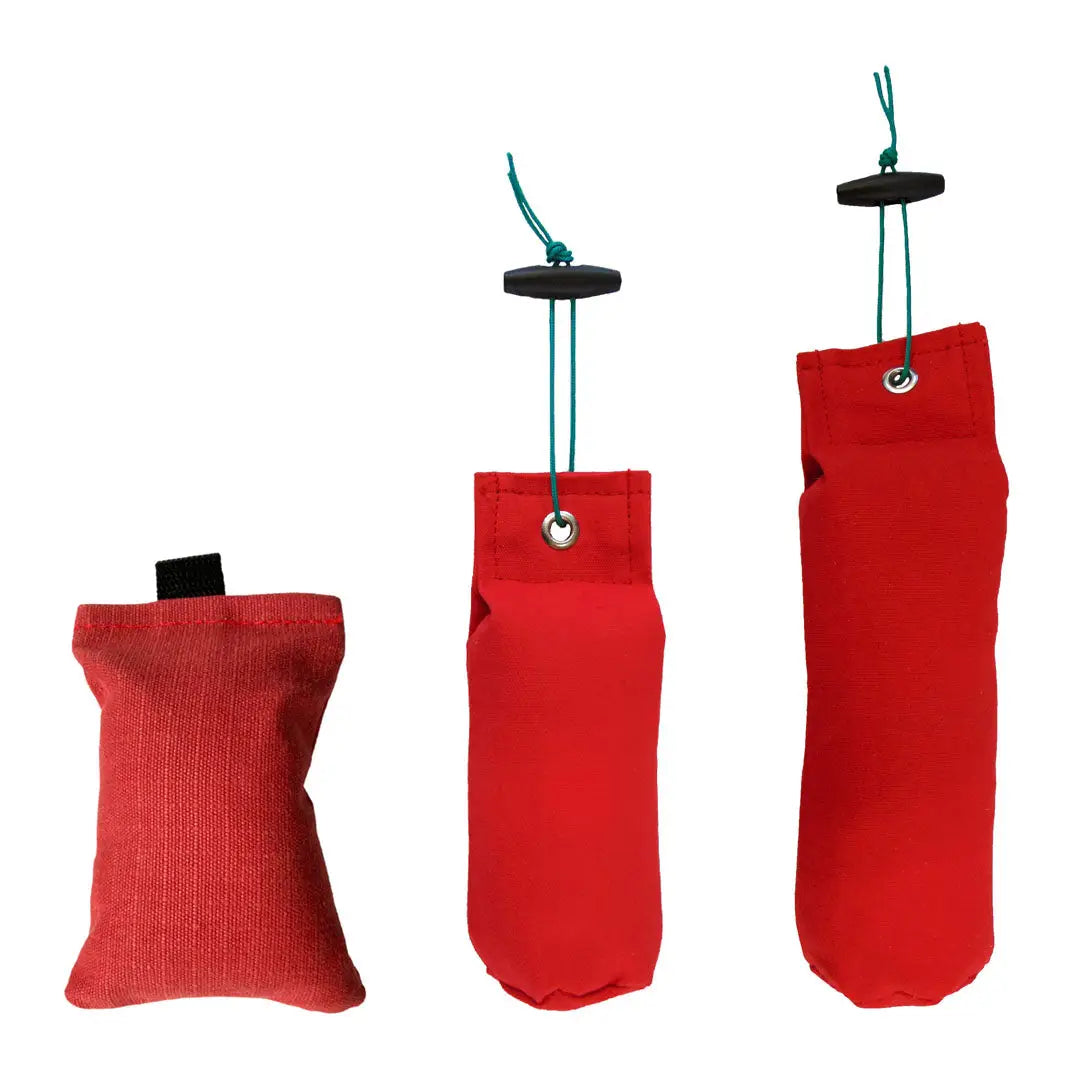 Three red Sporting Saint Flight Dummies for dog training and retrieval practice