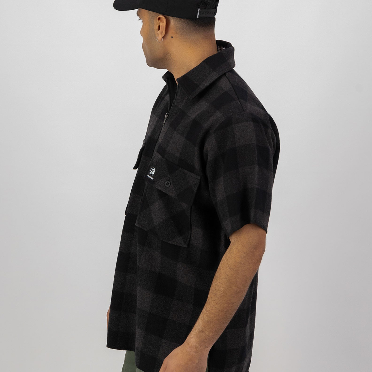 Black and gray plaid short-sleeve shirt perfect for country clothing and outdoor adventures