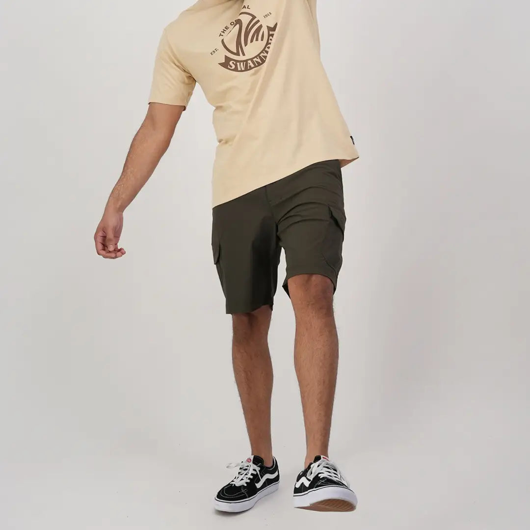 Person in beige t-shirt, wearing Lawson Walk Shorts and black and white sneakers