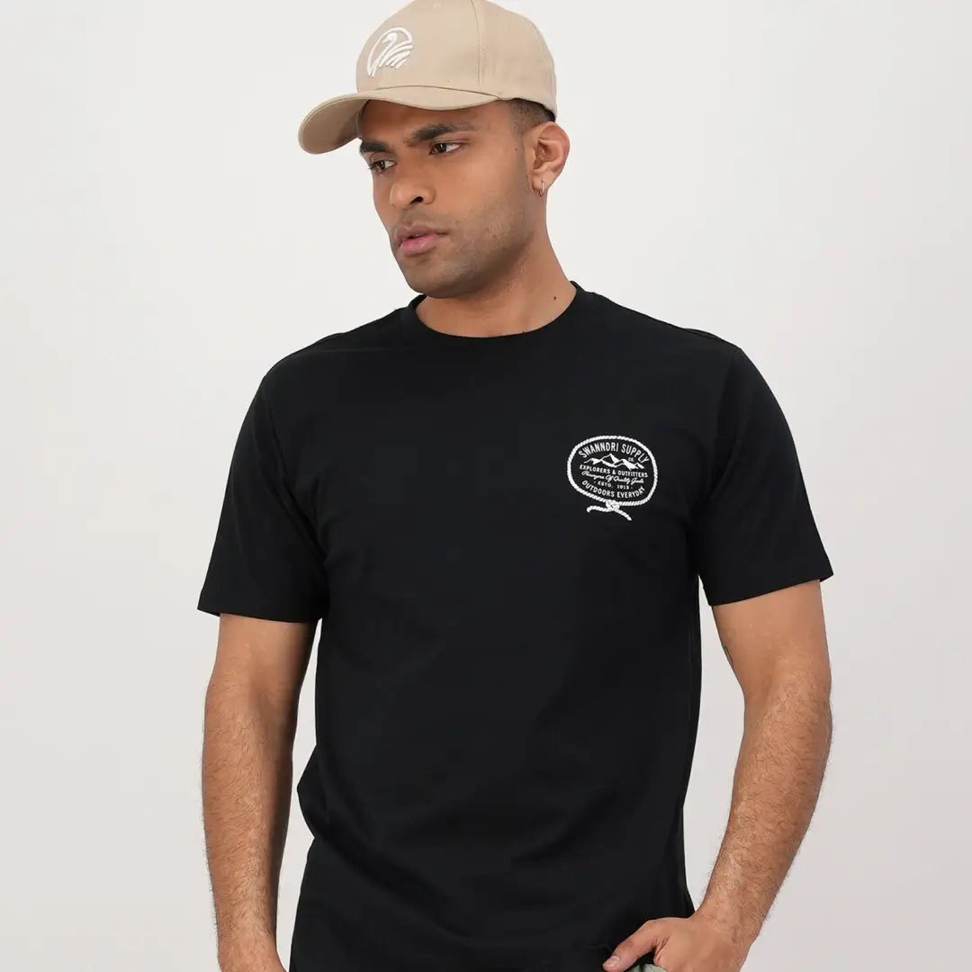 Man in a black t-shirt and beige cap, perfect for country clothing and outdoors vibes