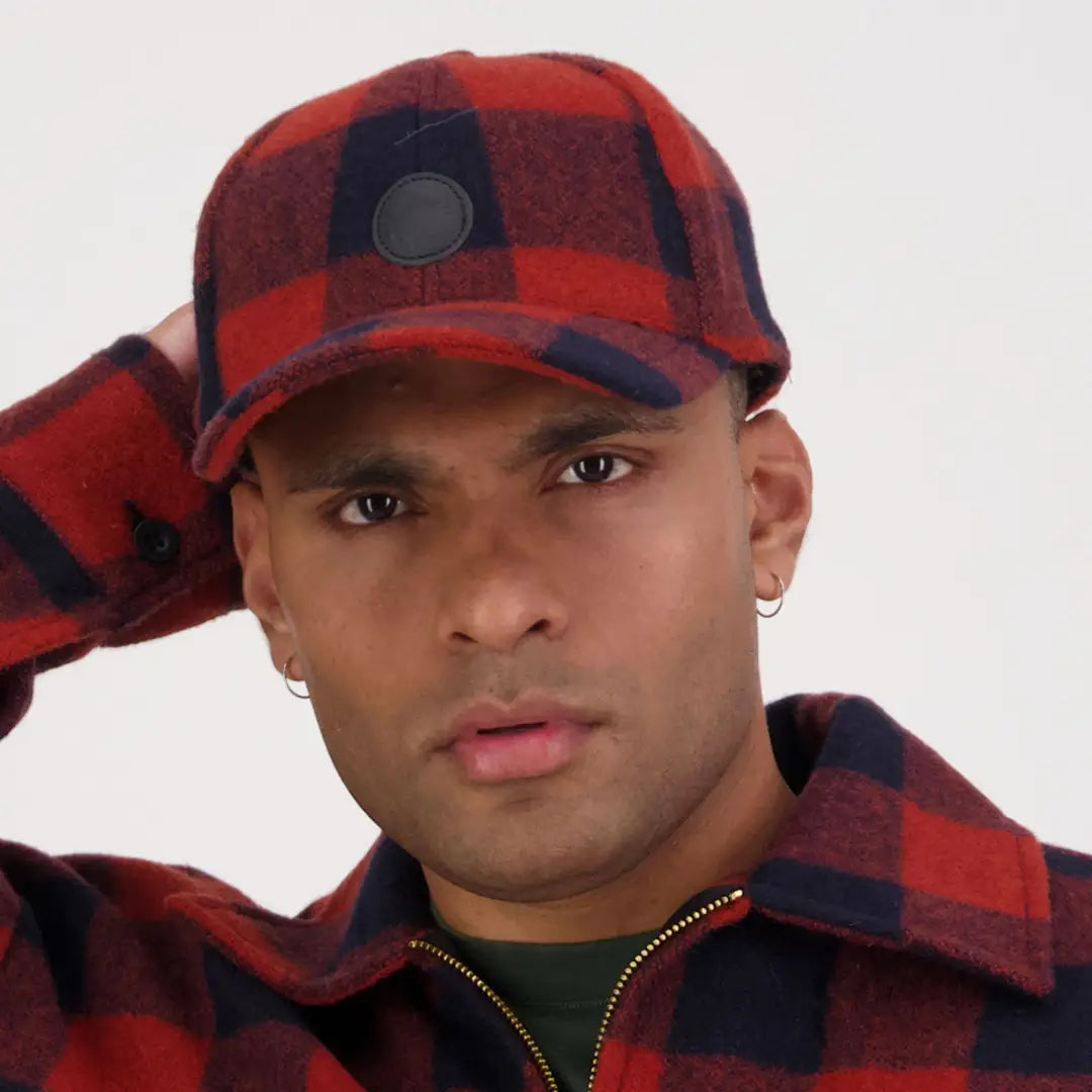 Red and black plaid Swanni Wool Baseball Cap worn by a stylish person