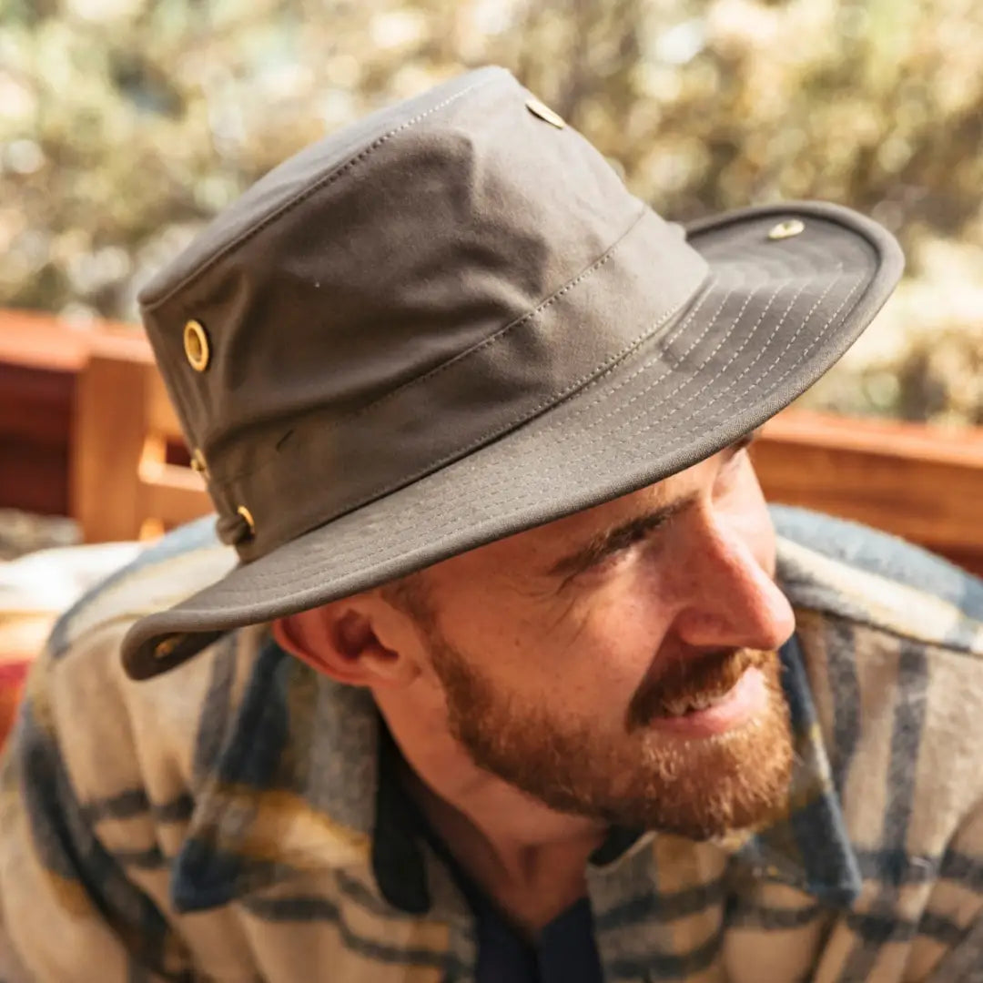 Bearded man rocking a gray Tilley Classic T3 cotton duck hat with wide brim