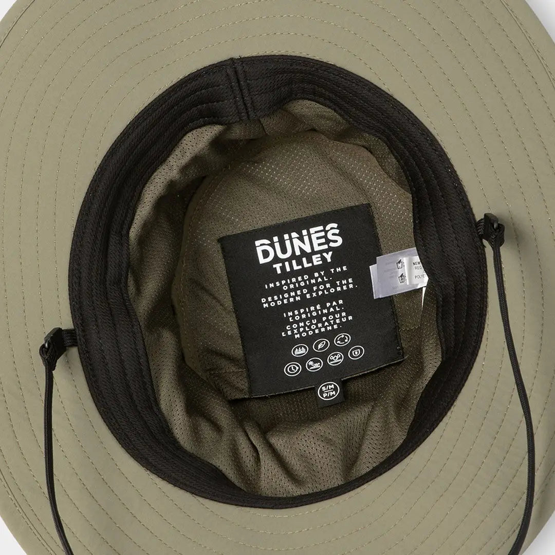 Beige Tilley Dunes Drifter Hat with dark band and visible interior tag