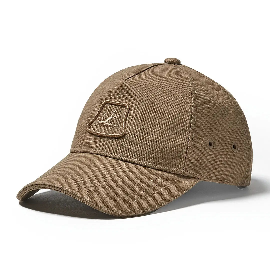 Tan Tilley Heritage Cap featuring an embroidered logo patch on the front