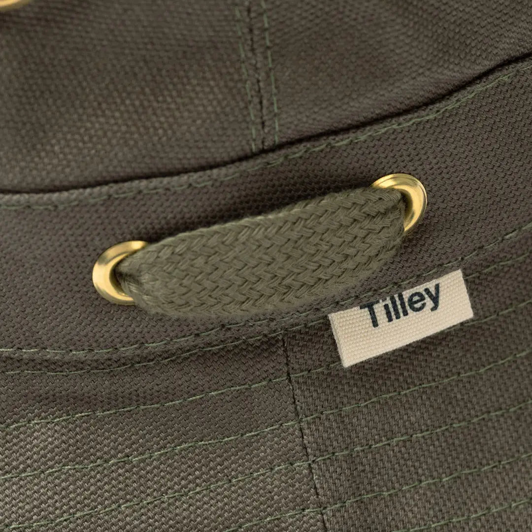 Dark green Tilley Iconic T1 Bucket Hat with fabric strap and grommets, durable water repellent