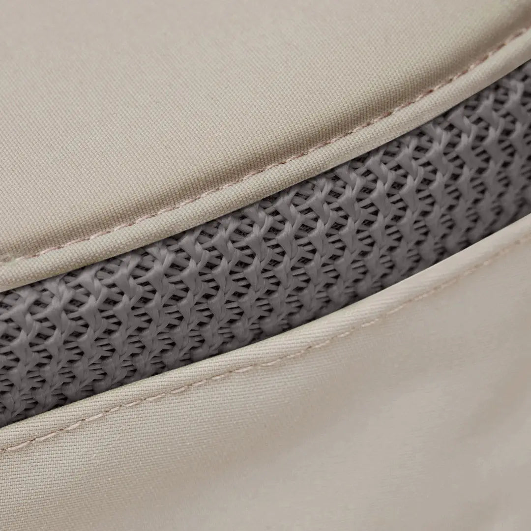 Close-up of the edge layers of a mattress showcasing fabric and mesh in a Tilley LTM6 Airflo Hat