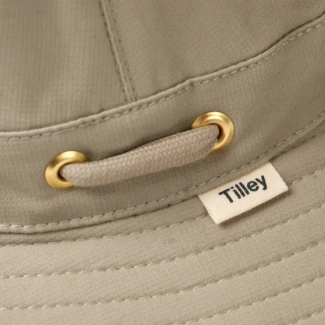 Beige Tilley T5MO Organic Airflo Hat with gold grommets and a stylish cord