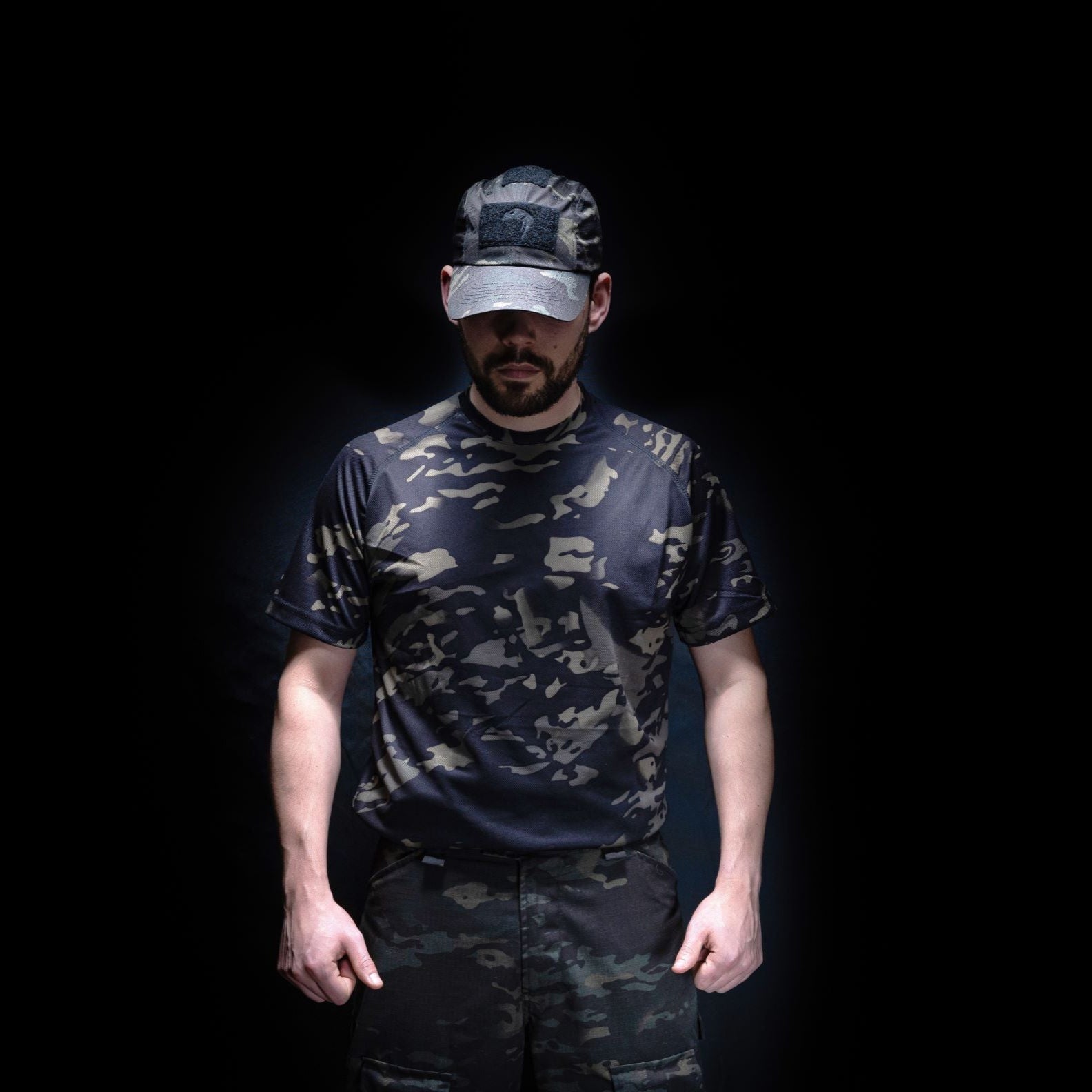 Camouflage-clad man wearing a Viper Mesh-Tech T-Shirt for style and comfort