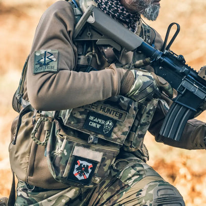 Armed soldier in combat gear showcasing the Viper Tactical Scrote Pouch with rifle