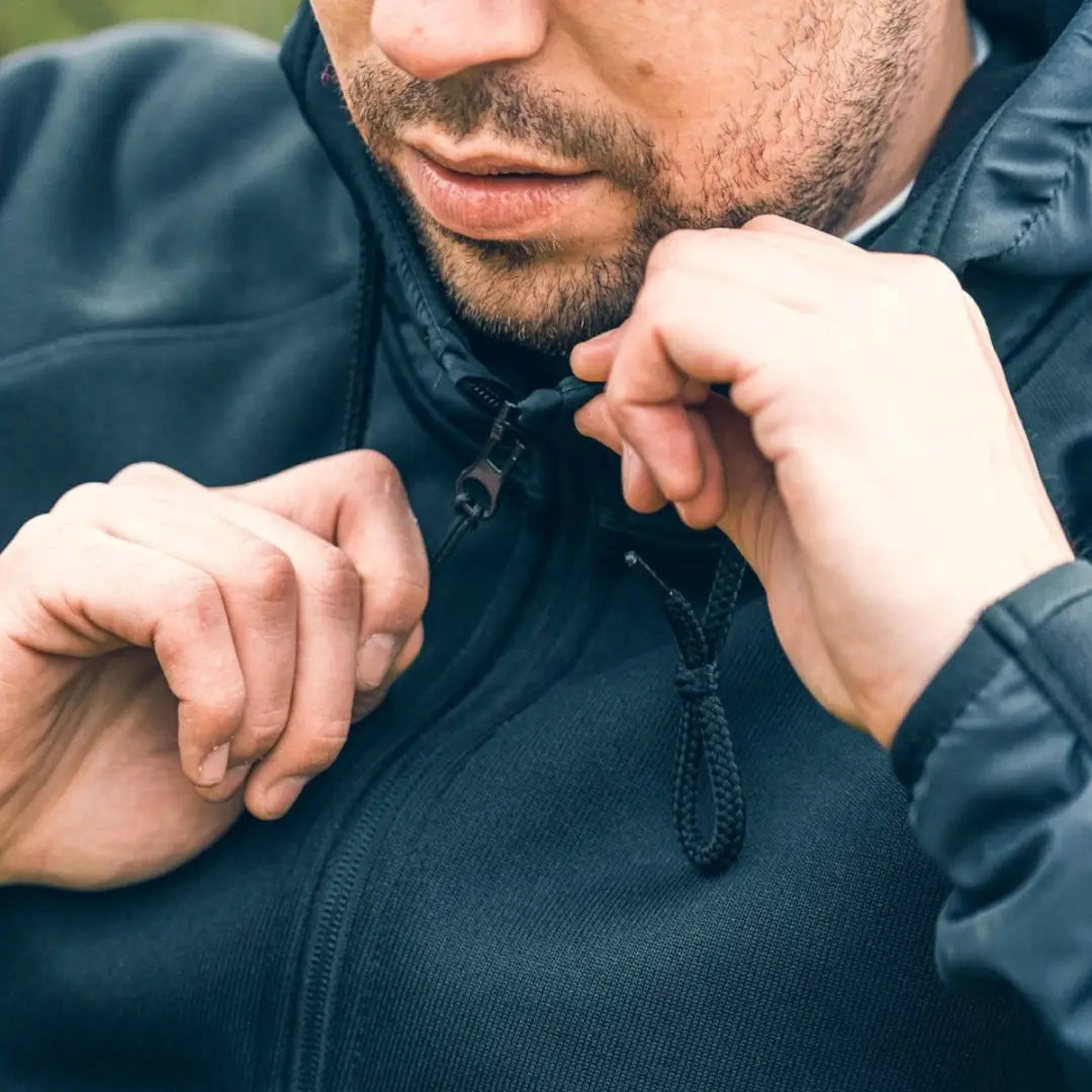 Dark blue Viper Storm Hoodie with brushed fleece lining being adjusted at the collar