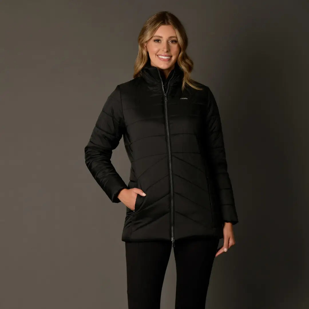 Smiling woman in a Black WeatherBeeta Harlow Puffer Jacket with wavy blonde hair