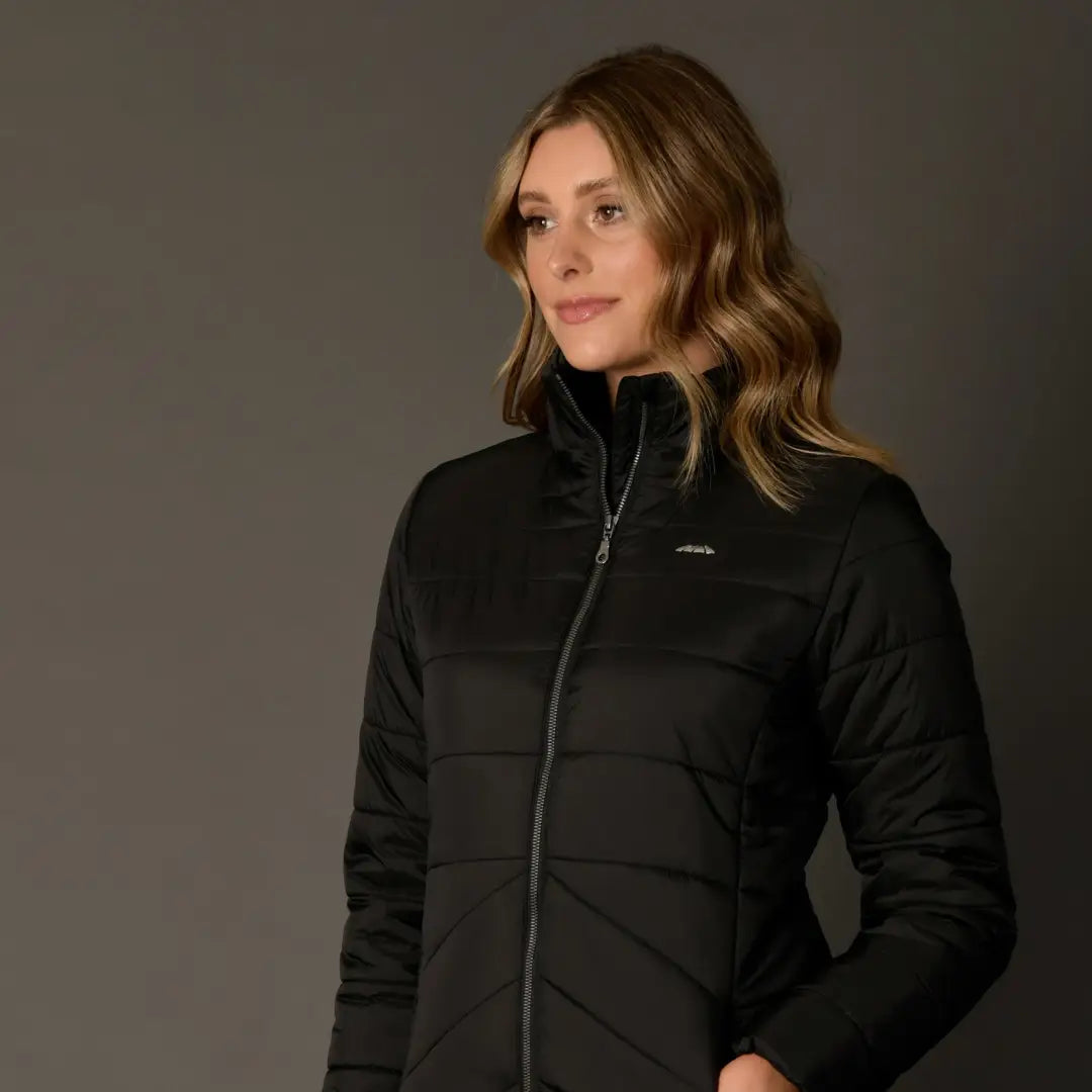 Woman with wavy blonde hair rocking a Black WeatherBeeta Harlow Puffer Jacket